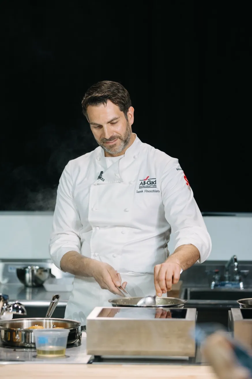 Derek Finocchiaro on stage at Bocuse D'Or as All-Clad Resident Chef
