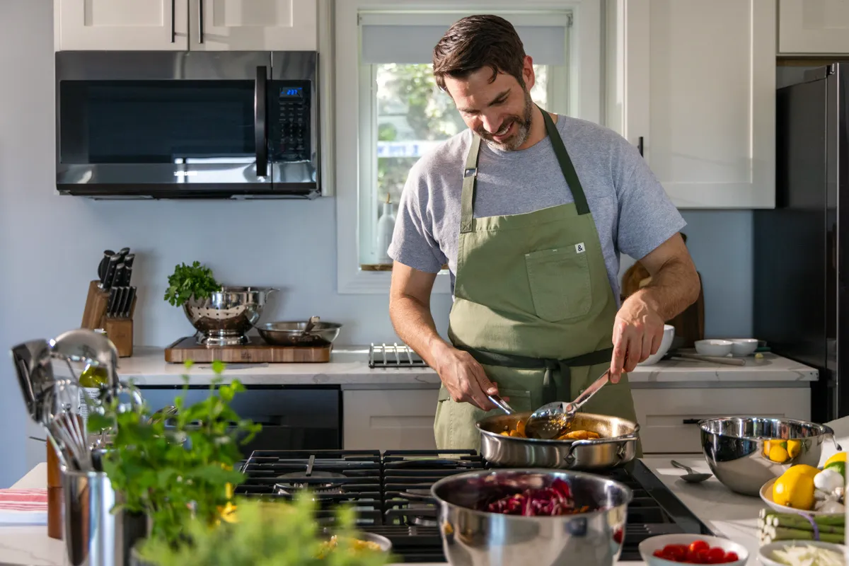 Derek Finocchiaro cooking in his home kitchen